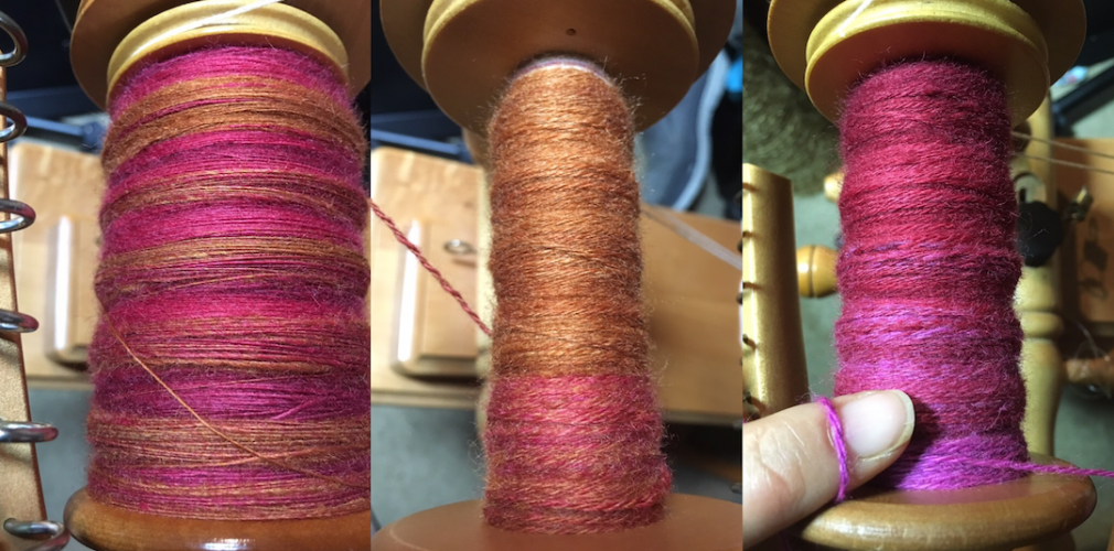 Pink, purple, and orange yarn on spools.